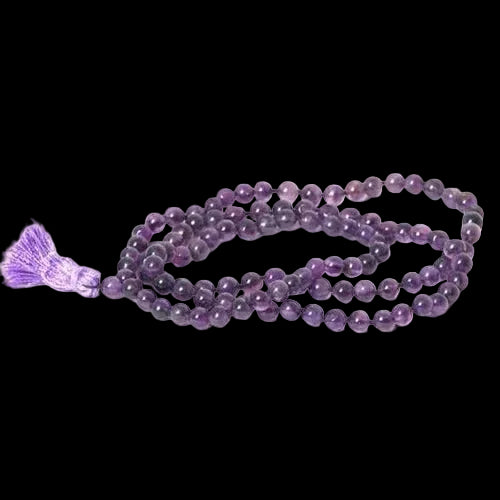 Purple beaded necklace with a tassel on a white background