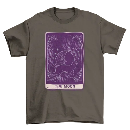 A dark gray crewneck t-shirt featuring a purple tarot card graphic labeled 'THE MOON' with a dog silhouette and rain motif, shown on a plain white background.