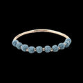 Light blue lava stone diffuser bracelet with gold-tone accents