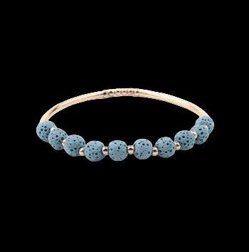 Light blue lava stone diffuser bracelet with gold-tone accents
