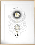 A framed art print featuring a gold and black astrological zodiac illustration for Leo, displayed on a white marble shelf against a dark black wall with a gold pendant light.